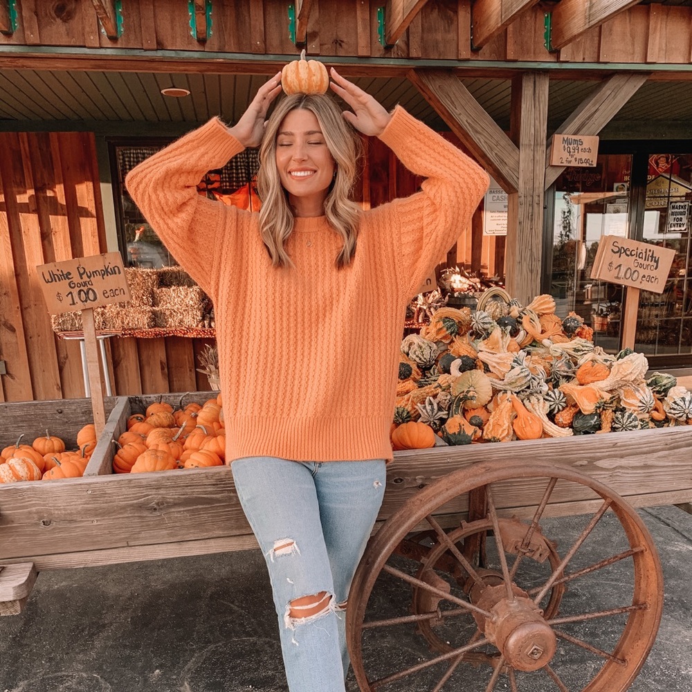 Orange sweater.